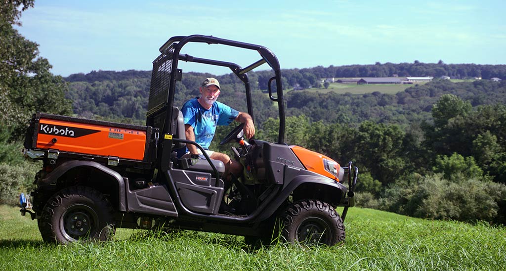 Murray Gates sits on a tractor